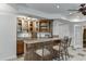 Entertain in this basement with a full wet bar featuring beautiful cabinetry and granite countertops at 1315 Chattahoochee Run Dr, Suwanee, GA 30024