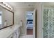 Bathroom with white cabinets and view into bedroom at 1315 Chattahoochee Run Dr, Suwanee, GA 30024