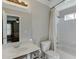 Bathroom with white tile, shower and view into bedroom at 1315 Chattahoochee Run Dr, Suwanee, GA 30024