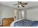 Bedroom with wood floors, ceiling fan and ensuite bathroom at 1315 Chattahoochee Run Dr, Suwanee, GA 30024