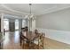 Bright dining room with hardwood floors, wainscotting, and natural light, great for Gathering gatherings at 1315 Chattahoochee Run Dr, Suwanee, GA 30024