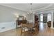 Lovely dining area featuring hardwood floors and natural light, perfect for enjoying meals at 1315 Chattahoochee Run Dr, Suwanee, GA 30024