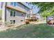 Exterior of home featuring a well-maintained lawn, wooden deck, and neutral siding at 1315 Chattahoochee Run Dr, Suwanee, GA 30024