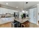 Well-equipped kitchen featuring stainless steel appliances, granite countertops, and a large central island at 1315 Chattahoochee Run Dr, Suwanee, GA 30024