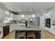 Beautiful kitchen with stainless steel appliances, granite countertops, and seating at the island, perfect for entertaining at 1315 Chattahoochee Run Dr, Suwanee, GA 30024