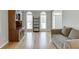 Inviting living room with hardwood floors, comfortable seating, and views of the front entryway at 1315 Chattahoochee Run Dr, Suwanee, GA 30024