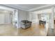 Spacious living room featuring hardwood floors, neutral walls, and a view towards the staircase and dining room at 1315 Chattahoochee Run Dr, Suwanee, GA 30024