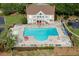 A large swimming pool is surrounded by lounge chairs and a sun deck in this inviting community at 1315 Chattahoochee Run Dr, Suwanee, GA 30024