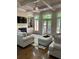 Inviting living room with a fireplace, built-in shelves, hardwood floors, and ample natural light at 1503 Riversedge Dr, Atlanta, GA 30339
