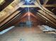 Spacious attic with exposed wood beams and potential for storage or additional living space at 1900 Ridgewood Ne Dr, Atlanta, GA 30307