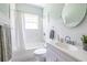 Classic bathroom with subway tiles, a shower-tub combo, a sink vanity, and a patterned tile floor at 1900 Ridgewood Ne Dr, Atlanta, GA 30307