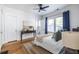 Bedroom featuring hardwood floors, neutral colors, a ceiling fan, and natural light at 1900 Ridgewood Ne Dr, Atlanta, GA 30307