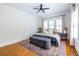 Spacious bedroom featuring wood floors, natural light from the window and minimalist design with neutral tones at 1900 Ridgewood Ne Dr, Atlanta, GA 30307