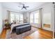 Bright bedroom with a ceiling fan, large windows, and stylish decor with a warm and inviting atmosphere at 1900 Ridgewood Ne Dr, Atlanta, GA 30307