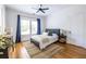 Cozy bedroom with hardwood floors, ceiling fan, and natural light from the large window at 1900 Ridgewood Ne Dr, Atlanta, GA 30307
