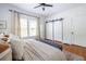 Inviting bedroom with natural light, a decorative rug, and stylish barn doors adding charm and functionality at 1900 Ridgewood Ne Dr, Atlanta, GA 30307