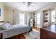 Light and airy bedroom with hardwood floors, built-in bookshelves, and stylish decor at 1900 Ridgewood Ne Dr, Atlanta, GA 30307