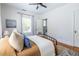 Airy bedroom with wood floors, lots of natural light from the window, and an ensuite bathroom at 1900 Ridgewood Ne Dr, Atlanta, GA 30307