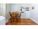 Inviting dining area with wooden floors, complemented by a classic table and chairs, adjacent to built-in storage for organized living at 1900 Ridgewood Ne Dr, Atlanta, GA 30307