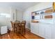 Charming dining area with hardwood floors, featuring a classic table and chairs, next to built-in storage, perfect for cozy meals at 1900 Ridgewood Ne Dr, Atlanta, GA 30307