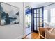 Welcoming entryway with blue-framed glass door and a glimpse into the bright, airy sunroom at 1900 Ridgewood Ne Dr, Atlanta, GA 30307