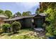 Charming home exterior surrounded by lush greenery, complemented by a cozy porch, creating a welcoming and inviting facade at 1900 Ridgewood Ne Dr, Atlanta, GA 30307