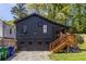 Exterior elevation of a two-story house with a garage and screened-in porch at 1900 Ridgewood Ne Dr, Atlanta, GA 30307