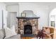 Living room with stone fireplace and classic design details at 1900 Ridgewood Ne Dr, Atlanta, GA 30307