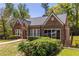 Beautiful brick home with lush front lawn and mature trees at 1900 Ridgewood Ne Dr, Atlanta, GA 30307