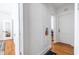 Hallway featuring hardwood floors, white walls, and built-in decor at 1900 Ridgewood Ne Dr, Atlanta, GA 30307