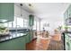 Spacious kitchen features green cabinetry, granite counters, stainless appliances, and a breakfast nook at 1900 Ridgewood Ne Dr, Atlanta, GA 30307
