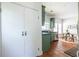 Galley kitchen with green cabinets and a view to the breakfast nook at 1900 Ridgewood Ne Dr, Atlanta, GA 30307