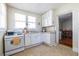 Functional kitchen featuring ample counter space, white cabinets, and modern appliances, creating a practical cooking environment at 1900 Ridgewood Ne Dr, Atlanta, GA 30307
