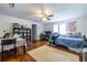 Bright living area with hardwood floors, a ceiling fan, and mixed living and work space setup at 1900 Ridgewood Ne Dr, Atlanta, GA 30307