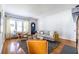 Bright living room features hardwood floors, a neutral color palette, and large window at 1900 Ridgewood Ne Dr, Atlanta, GA 30307