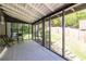Back porch, screened in with room for chairs and views of the backyard space at 1900 Ridgewood Ne Dr, Atlanta, GA 30307