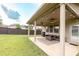 Enjoy the outdoors on this patio with stylish furniture and a ceiling fan for added comfort at 375 Madison Grace Ave, Mcdonough, GA 30252