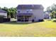 Spacious backyard featuring a covered patio, offering an inviting space for outdoor relaxation at 375 Madison Grace Ave, Mcdonough, GA 30252