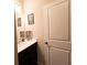 Cozy bathroom featuring a vanity with dark wood cabinets and framed art above the sink at 375 Madison Grace Ave, Mcdonough, GA 30252