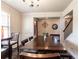 Dining room features hardwood floors, wainscoting, and a staircase at 375 Madison Grace Ave, Mcdonough, GA 30252