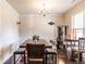 Formal dining room featuring a chandelier, large window, and space to entertain at 375 Madison Grace Ave, Mcdonough, GA 30252
