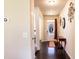 Inviting entryway featuring hardwood floors, neutral paint, and elegant decor, leading into the home at 375 Madison Grace Ave, Mcdonough, GA 30252