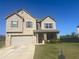 Charming two-story home with a two-car garage, and a well-maintained lawn at 375 Madison Grace Ave, Mcdonough, GA 30252