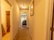 Hallway with carpet and a decorative hanging light fixture and furniture at 375 Madison Grace Ave, Mcdonough, GA 30252