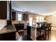 Open concept kitchen with granite countertops, stainless steel appliances, and a breakfast bar at 375 Madison Grace Ave, Mcdonough, GA 30252