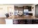 Open kitchen featuring granite countertops, stainless appliances, and dark cabinetry at 375 Madison Grace Ave, Mcdonough, GA 30252