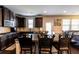 Spacious kitchen with granite countertops, barstool seating, stainless steel appliances, and dark cabinetry at 375 Madison Grace Ave, Mcdonough, GA 30252