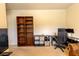 This office features a built-in bookshelf, cube storage, and a work area with monitors at 375 Madison Grace Ave, Mcdonough, GA 30252