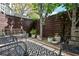 The outdoor patio features a patterned rug, bench seating and lush potted plants at 588 Bismark Ne Rd, Atlanta, GA 30324
