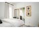 Calm bedroom with a large mirror and artwork, leading into an ensuite bathroom, offering a private sanctuary at 588 Bismark Ne Rd, Atlanta, GA 30324